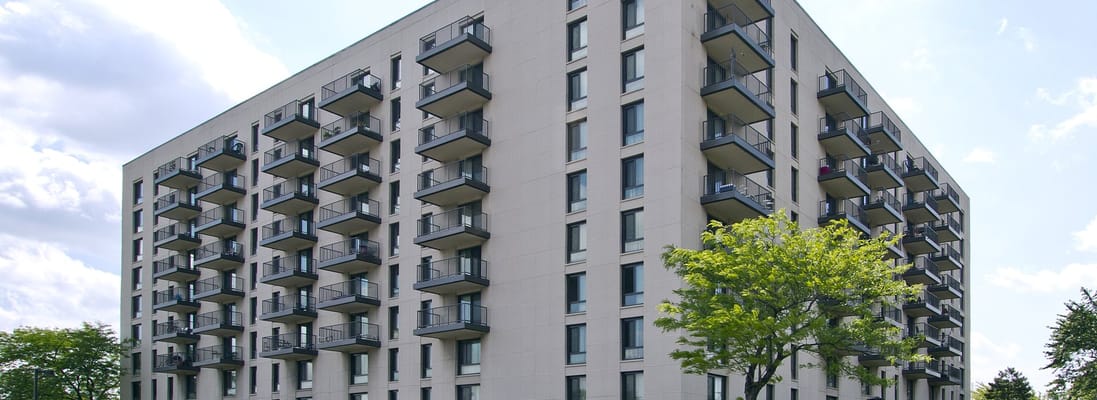 Exterior view of a senior living facility with balconies