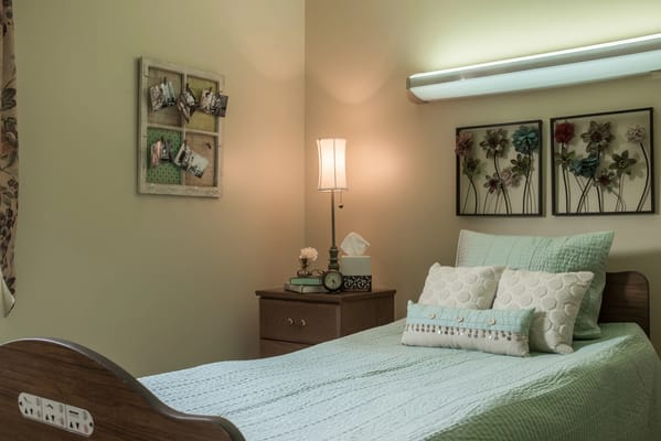 Cozy resident room with floral decor and soft lighting
