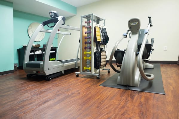 Well-equipped therapy gym with exercise machines