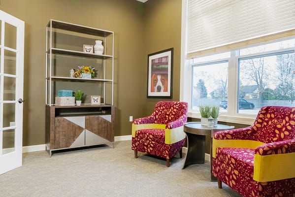 Bright interior lounge area with colorful chairs