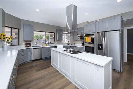 Modern kitchen with gray cabinets and natural light