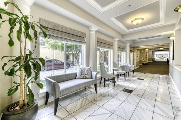 Bright interior corridor with seating and plants