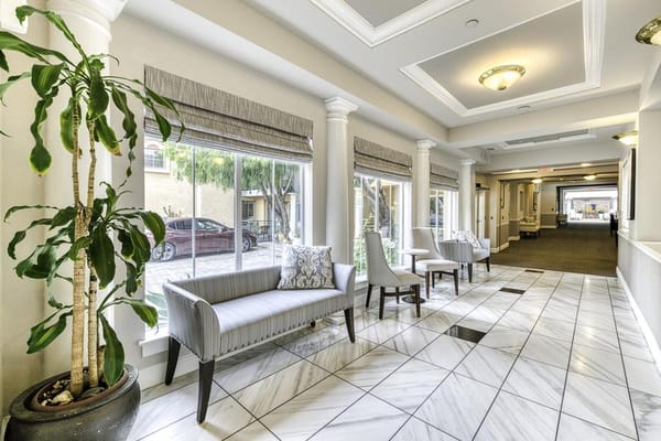 Bright interior corridor with seating and plants