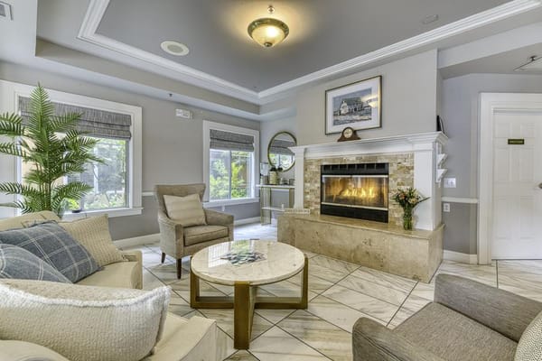 Cozy common area with a fireplace and seating