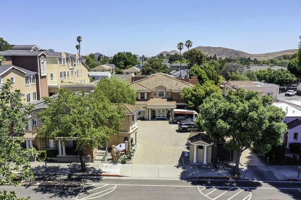 Aerial view of a senior living facility with outdoor spaces