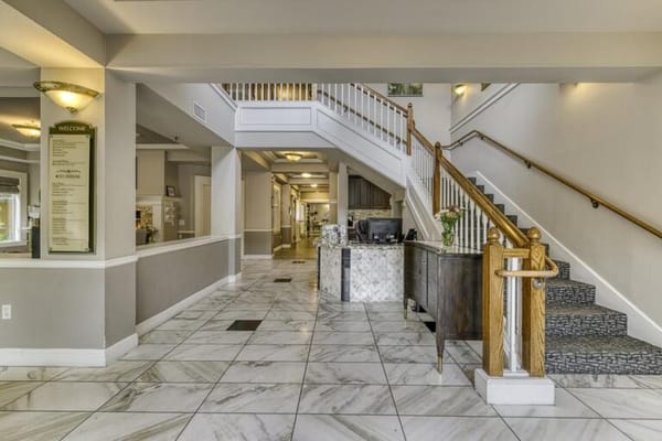 Interior lobby with staircase and reception area