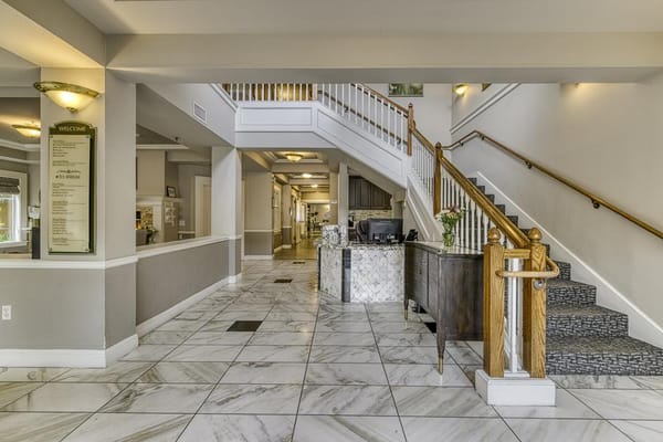 Interior lobby with staircase and reception area