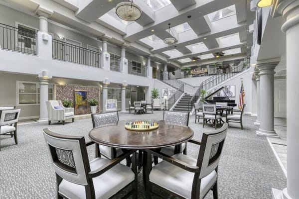 Bright interior common area with seating and decorations