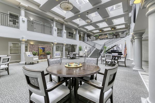 Bright interior common area with seating and decorations