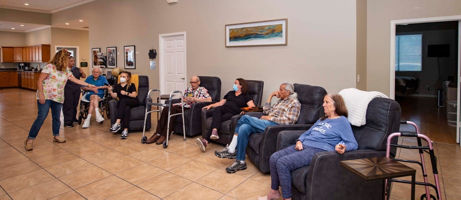 Residents engaging in a social activity in the lounge area