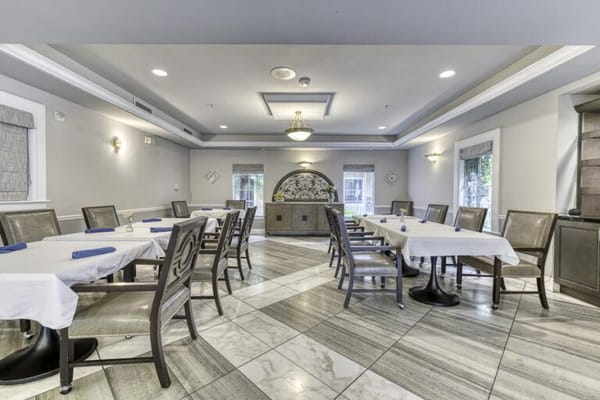 Dining area with elegant seating and decor