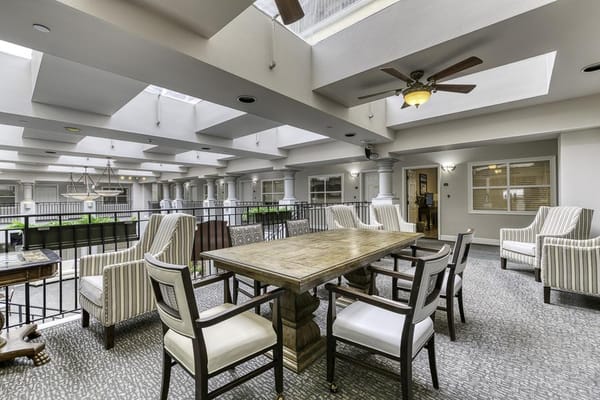 Bright common area with seating and skylights