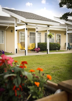 Outdoor seating area with colorful flowers