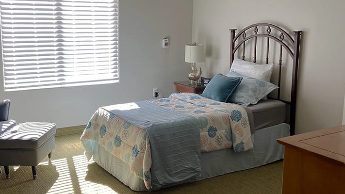 Cozy resident room with a bed and window