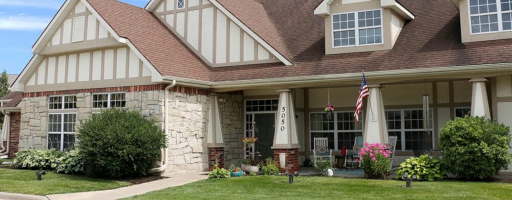 Exterior view of an assisted living facility with garden