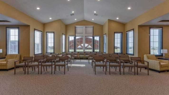 Bright common area with seating and large windows