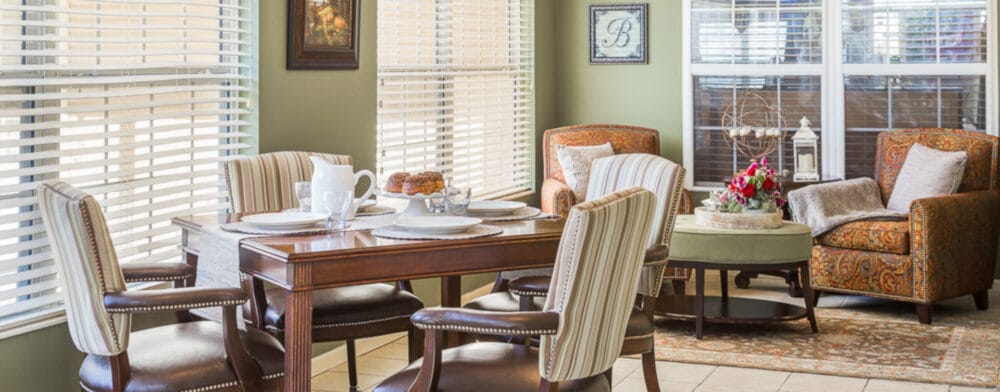 Cozy interior common area with seating and dining table