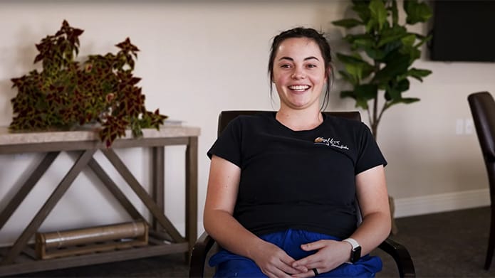 Staff member smiling in a common area