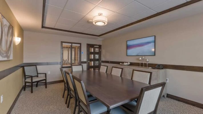 Interior photo of a dining area with a long table