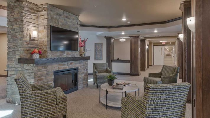 Interior common area with seating and a fireplace