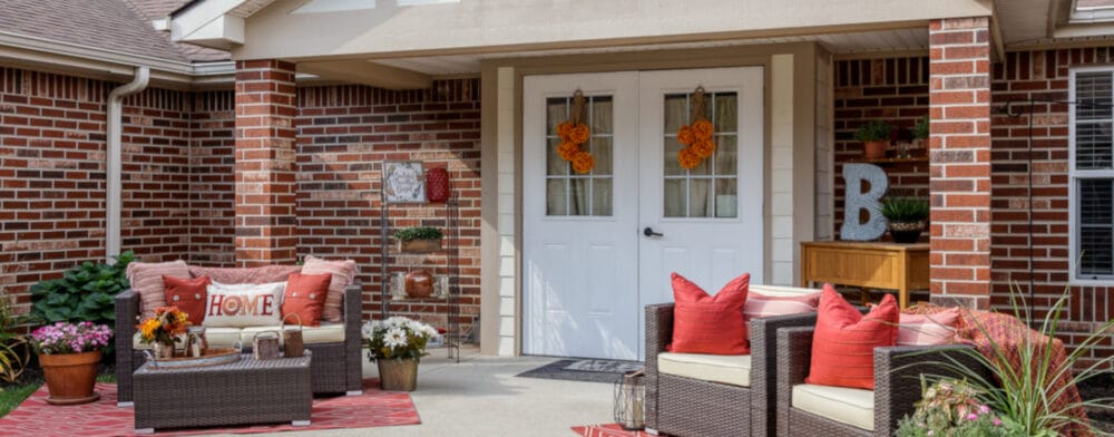 Cozy outdoor seating area with flowers and decorations