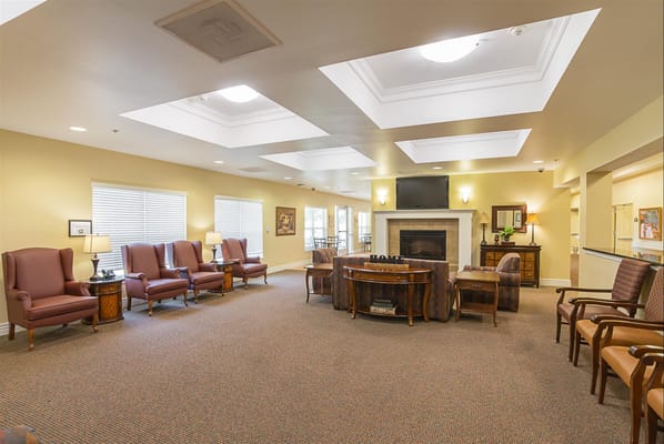 Common area with seating and a fireplace