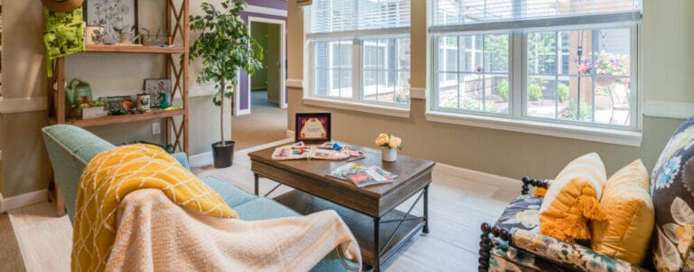 A cozy common area with seating and natural light