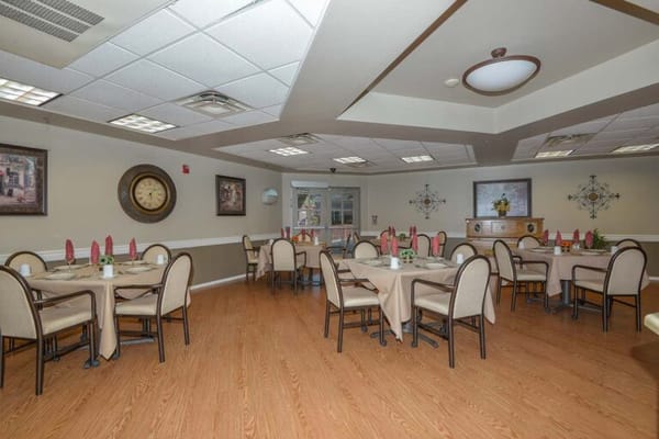 A well-set dining room with tables and chairs