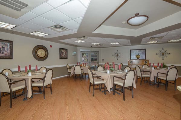A well-set dining room with tables and chairs