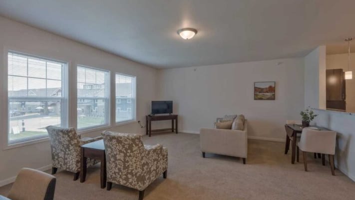 Bright interior area with seating and a TV