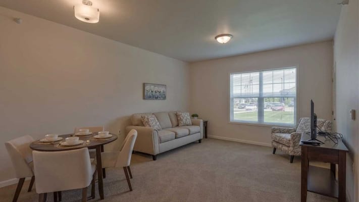 Well-furnished resident room with dining area