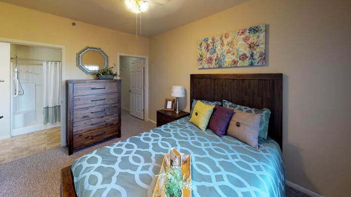 Cozy resident room with floral decor and comfortable furnishings