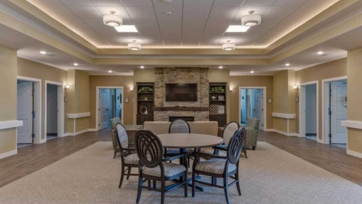 Interior common area with seating and a fireplace