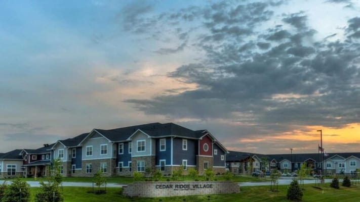 Exterior view of Cedar Ridge Village at sunset