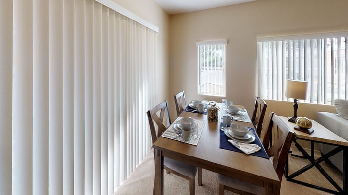 Dining area with table set for a meal