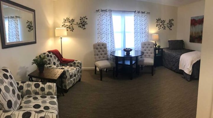 Cozy interior of a resident room with seating area