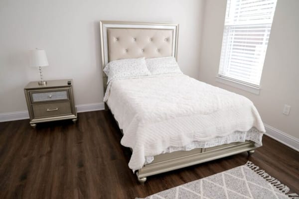 Cozy private resident room with plush bedding