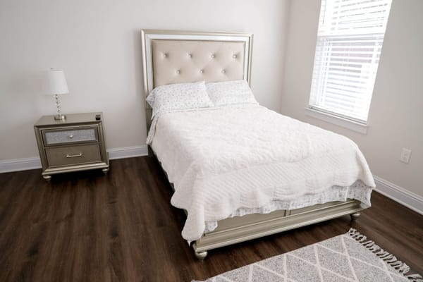 Cozy private resident room with plush bedding