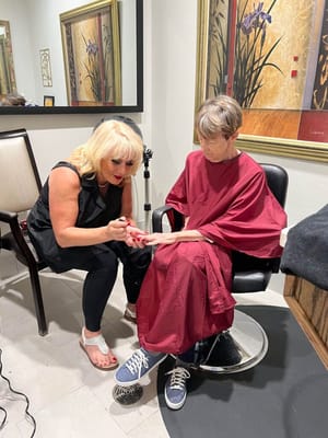 Resident receiving a manicure in a salon