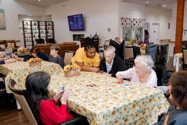 Residents playing cards in a common area