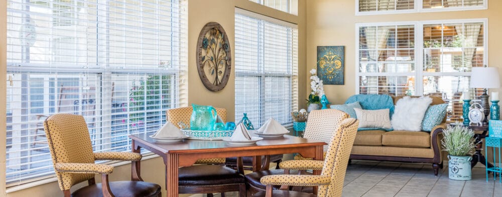 Bright common area with seating and dining table