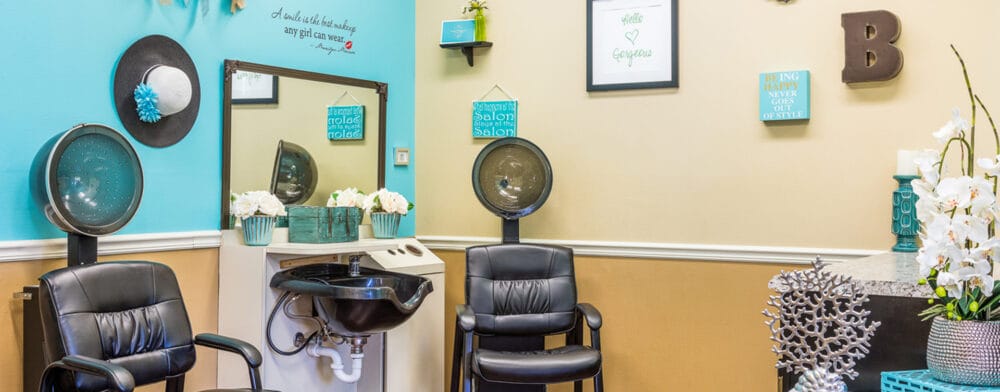 Hair salon area with styling chairs and mirrors