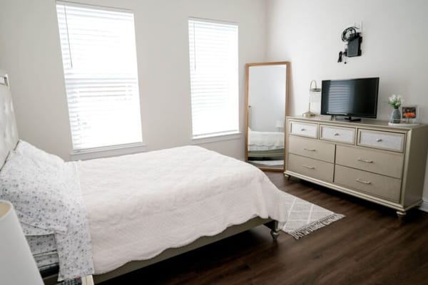 Cozy private resident room with a bed and TV