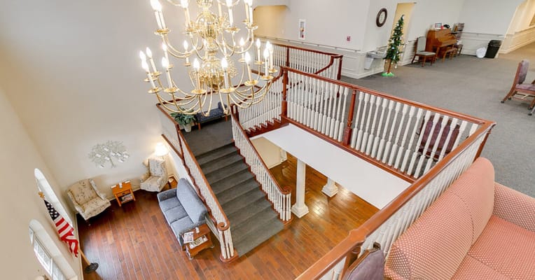 View of the lobby with a chandelier and staircase