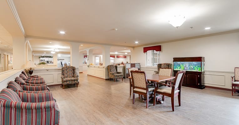 Common area with chairs and an aquarium