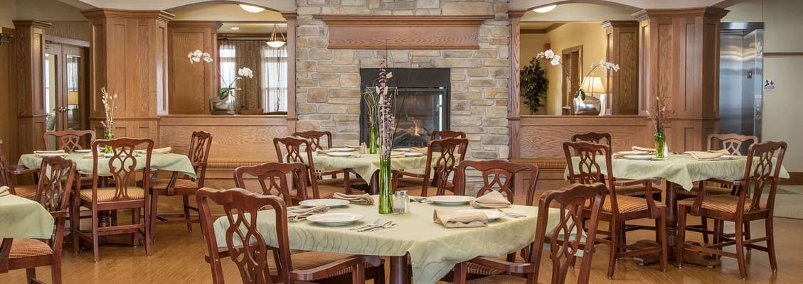Dining room with elegant tables and a fireplace