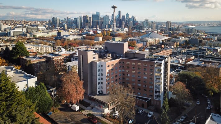 Aerial view of Bayview Retirement Community with city skyline