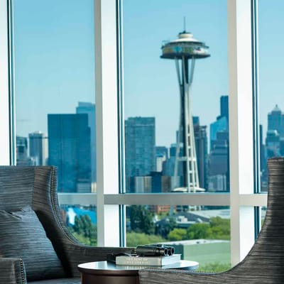 Interior view with seating and Seattle Space Needle in the background