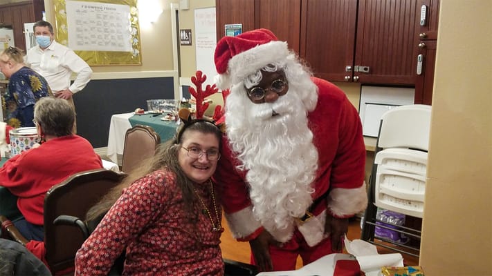 Residents enjoying a holiday celebration with Santa