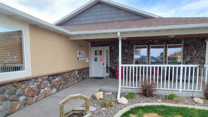 Entrance of BeeHive Homes of Great Falls with stone facade
